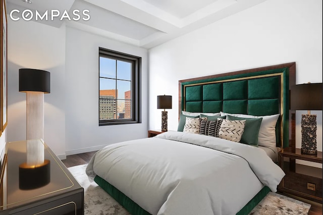 bedroom featuring wood finished floors and baseboards