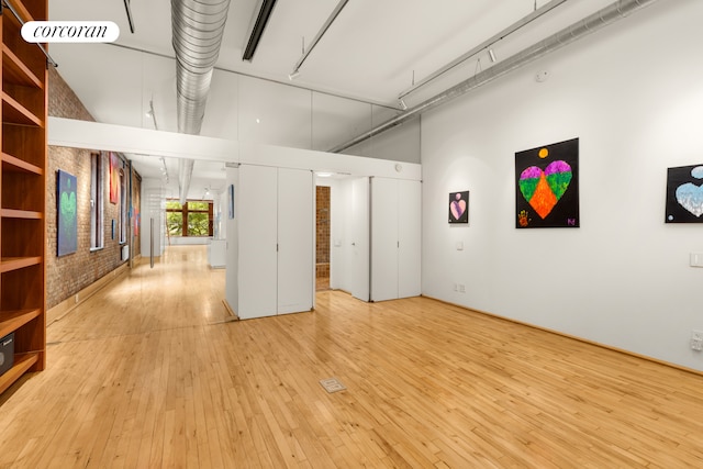 25 E 4th St Unit 2, New York City, NY 10003 - empty room featuring light wood-type flooring and a towering ceiling