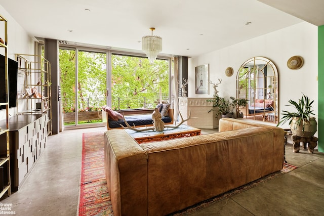 living room featuring finished concrete floors and floor to ceiling windows