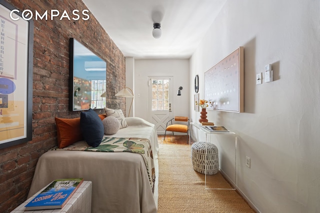 carpeted bedroom with a wall mounted air conditioner