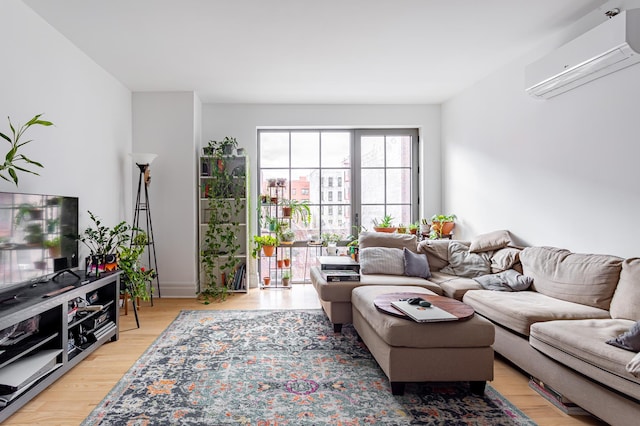 77 Clarkson Ave Unit 4-C, New York City, NY 11226 - living room with a wall mounted AC and light wood-type flooring