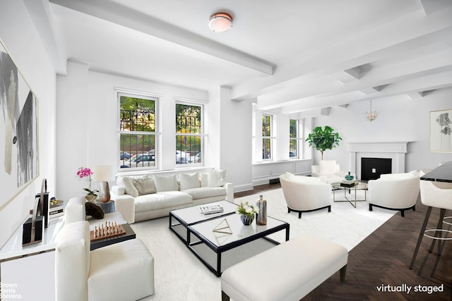 living area with beam ceiling and a fireplace