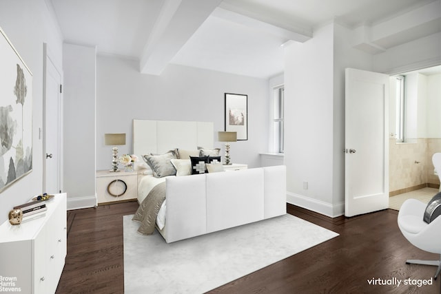 bedroom featuring beam ceiling, dark wood-style floors, and baseboards