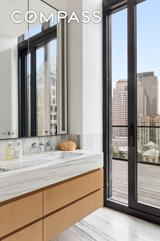 bathroom with vanity and wood finished floors