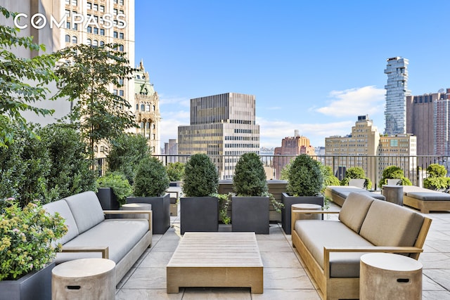 view of patio / terrace featuring an outdoor hangout area and a skyline view