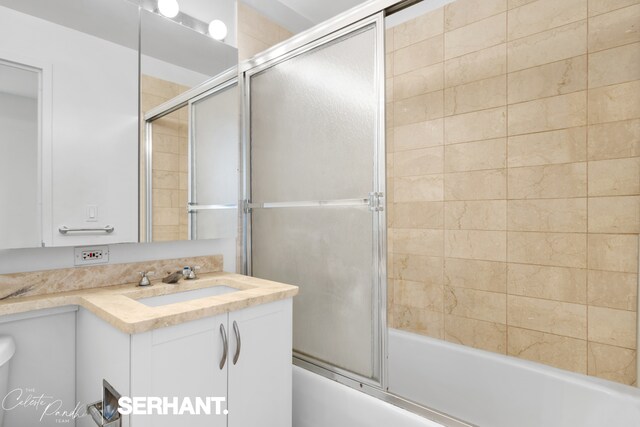 250 E 30th St Unit 8D, New York City, NY 10016 - bathroom featuring vanity and combined bath / shower with glass door