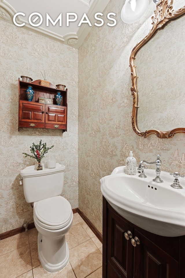 138 W 73rd St, New York City, NY 10023 - half bathroom featuring toilet, baseboards, and tile patterned floors