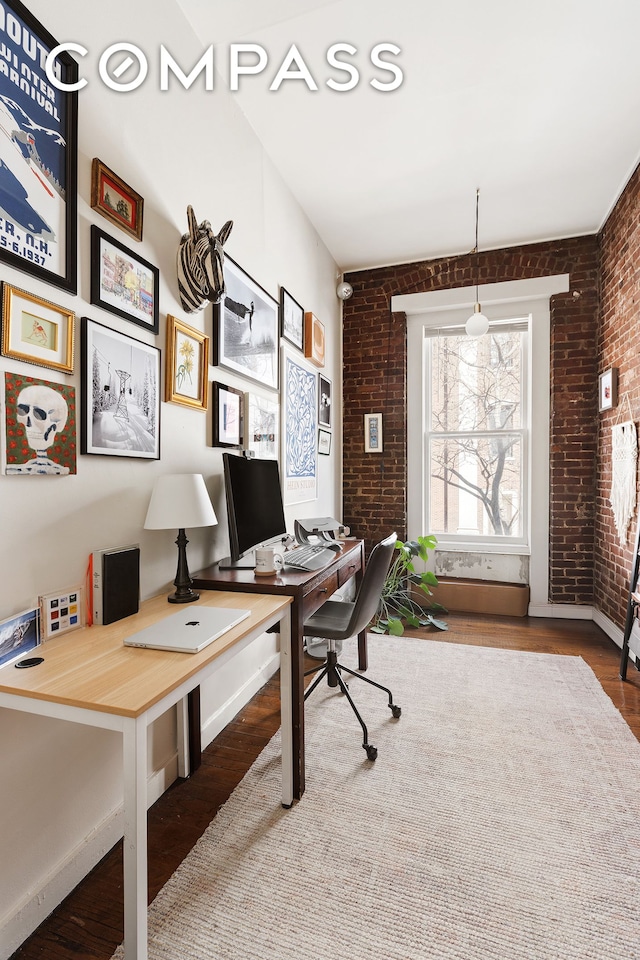 138 W 73rd St, New York City, NY 10023 - office with brick wall, wood finished floors, and baseboards