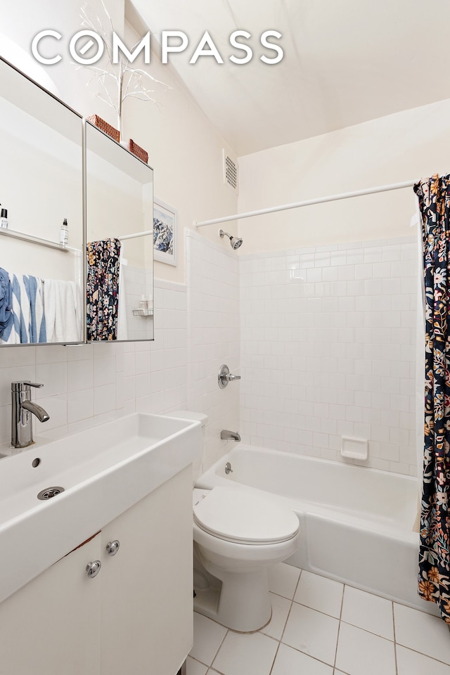 138 W 73rd St, New York City, NY 10023 - bathroom with tile patterned flooring, tile walls, shower / tub combo, toilet, and vanity