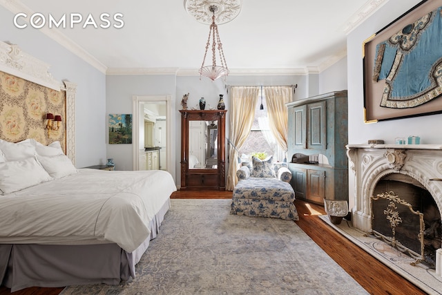 138 W 73rd St, New York City, NY 10023 - bedroom featuring wood finished floors, crown molding, and ensuite bath