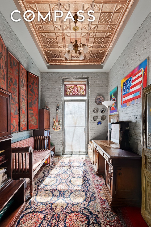 138 W 73rd St, New York City, NY 10023 - entryway with an ornate ceiling, a raised ceiling, and a chandelier