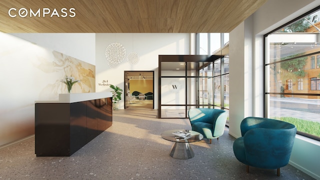 community lobby with wooden ceiling and a towering ceiling