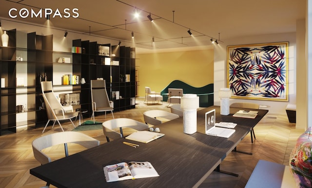 dining space featuring track lighting