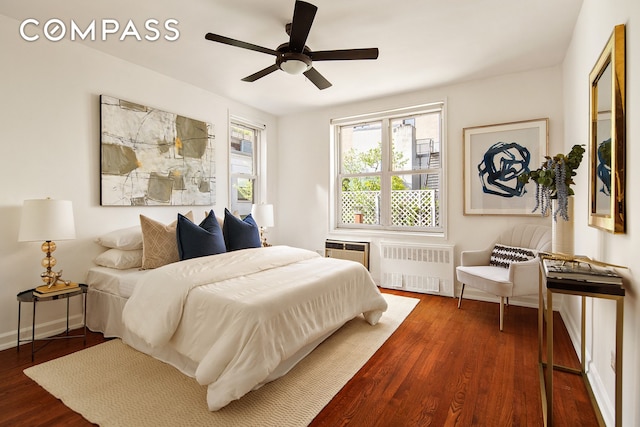 88 Bleecker St Unit 6C, New York City, NY 10012 - bedroom featuring radiator heating unit, wood finished floors, a ceiling fan, and baseboards