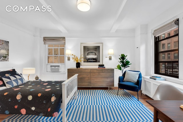 151 E 83rd St Unit 4Gh, New York City, NY 10028 - bedroom featuring beam ceiling, cooling unit, and wood finished floors