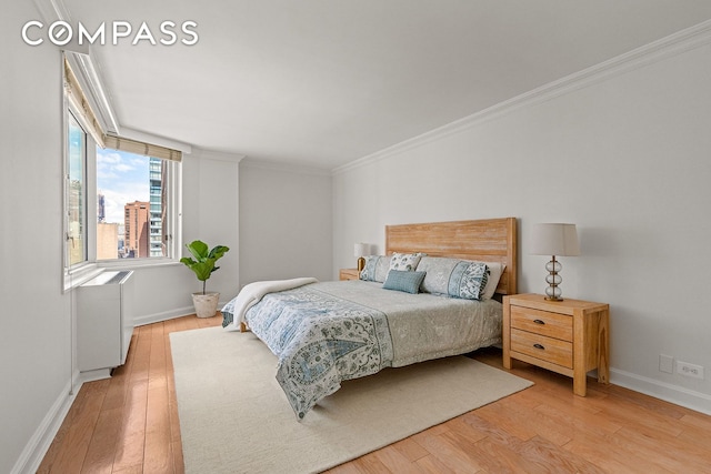 245 E 54th St Unit 25St, New York City, NY 10022 - bedroom with wood finished floors, ornamental molding, and baseboards