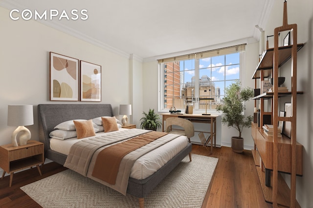245 E 54th St Unit 25St, New York City, NY 10022 - bedroom featuring ornamental molding, wood finished floors, and baseboards