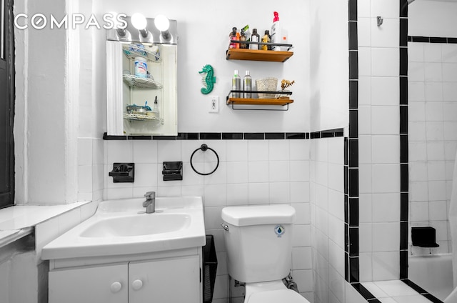 465 Eastern Pkwy Unit D, New York City, NY 11216 - full bathroom featuring toilet, vanity, and tile walls