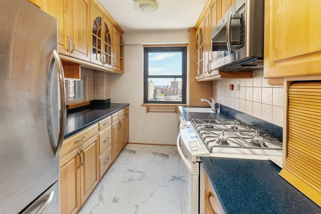 kitchen with stainless steel appliances, light marble finish flooring, decorative backsplash, glass insert cabinets, and a sink