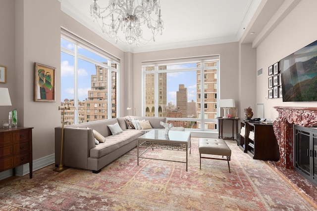 205 E 85th St Unit Ph2B, New York City, NY 10028 - living room featuring a chandelier, plenty of natural light, ornamental molding, and a fireplace