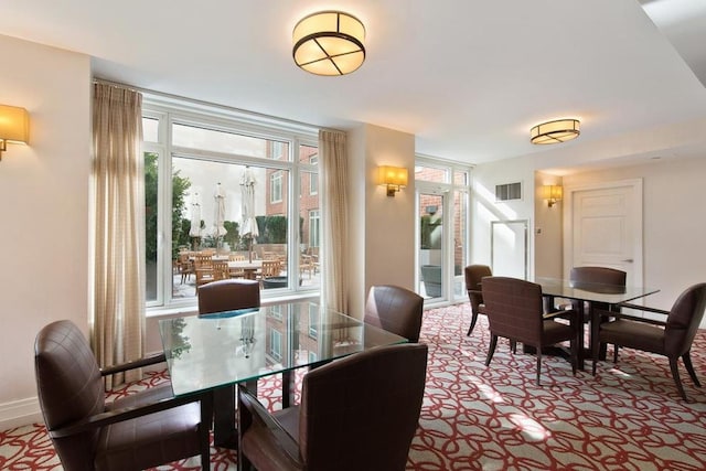 205 E 85th St Unit Ph2B, New York City, NY 10028 - carpeted dining area with baseboards