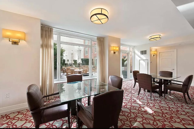 205 E 85th St Unit Ph2B, New York City, NY 10028 - carpeted dining area with baseboards