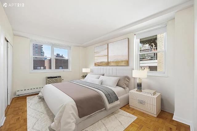 63 E 9th St Unit 7-T, New York City, NY 10003 - bedroom with a baseboard heating unit and a wall mounted AC