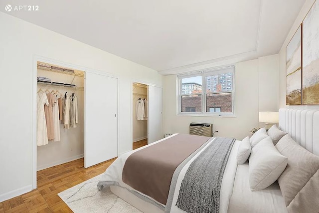 63 E 9th St Unit 7-T, New York City, NY 10003 - bedroom with baseboards and a wall mounted AC