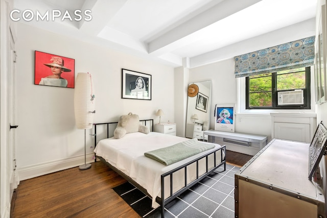 bedroom with dark wood-style floors, beamed ceiling, and cooling unit