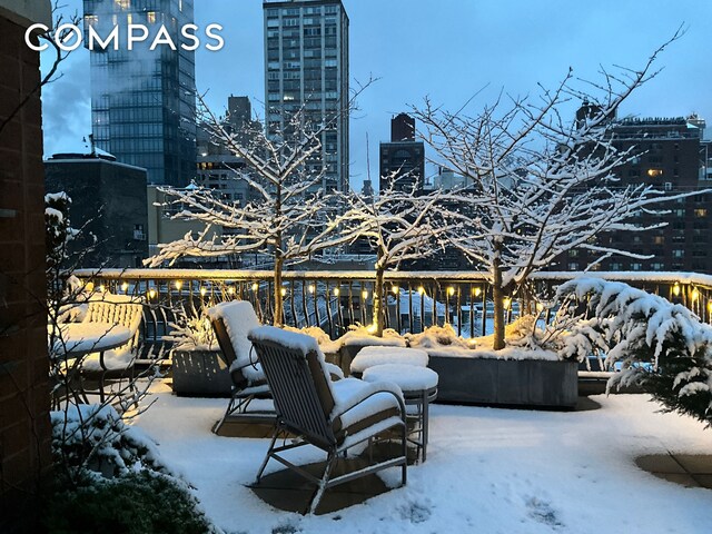 343 E 74th St Unit 15D, New York City, NY 10021 - snow covered patio with a view of city