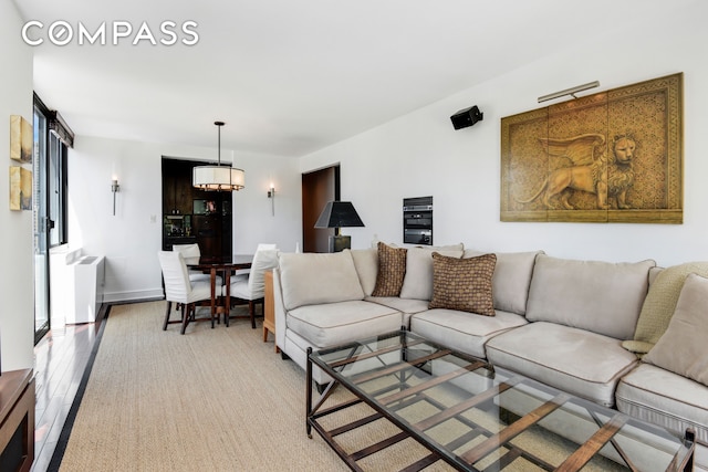 343 E 74th St Unit 15D, New York City, NY 10021 - living room with light wood-type flooring