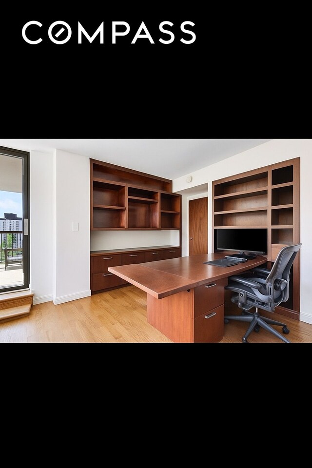 343 E 74th St Unit 15D, New York City, NY 10021 - office area featuring light wood-style floors and built in desk