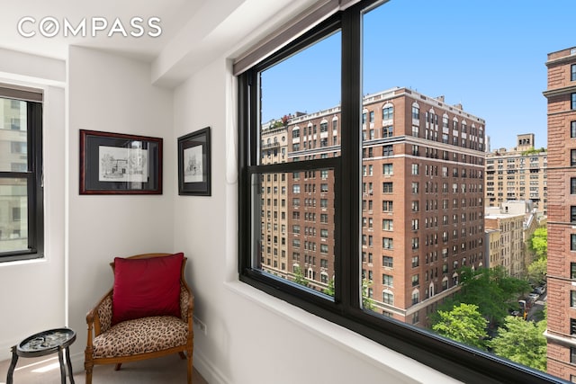 1065 Park Ave Unit 11A, New York City, NY 10128 - sitting room featuring baseboards and a city view
