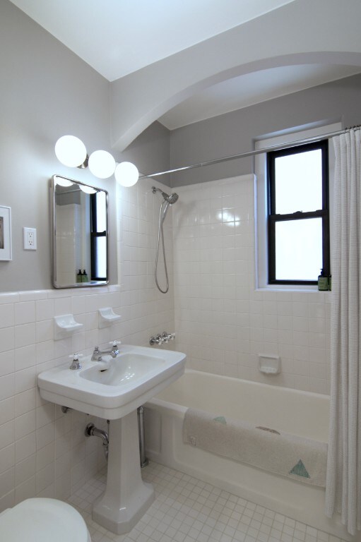 811 Cortelyou Rd Unit 2O, New York City, NY 11218 - bathroom with tile walls, shower / bathtub combination with curtain, tile patterned flooring, and toilet