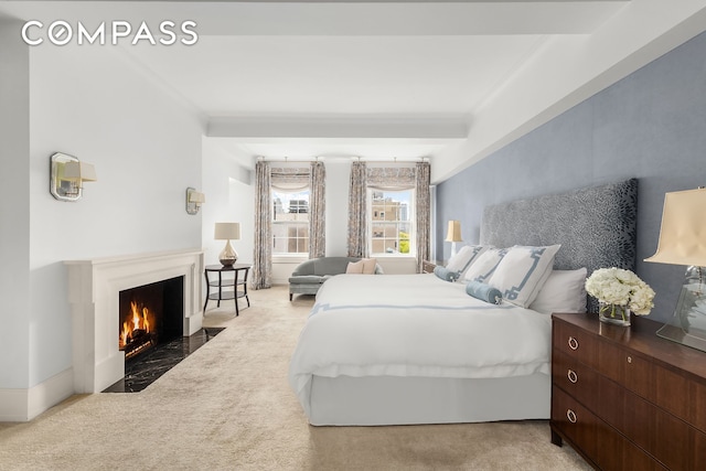 40 E 66th St Unit 12B, New York City, NY 10065 - bedroom featuring carpet flooring, a fireplace with flush hearth, and ornamental molding