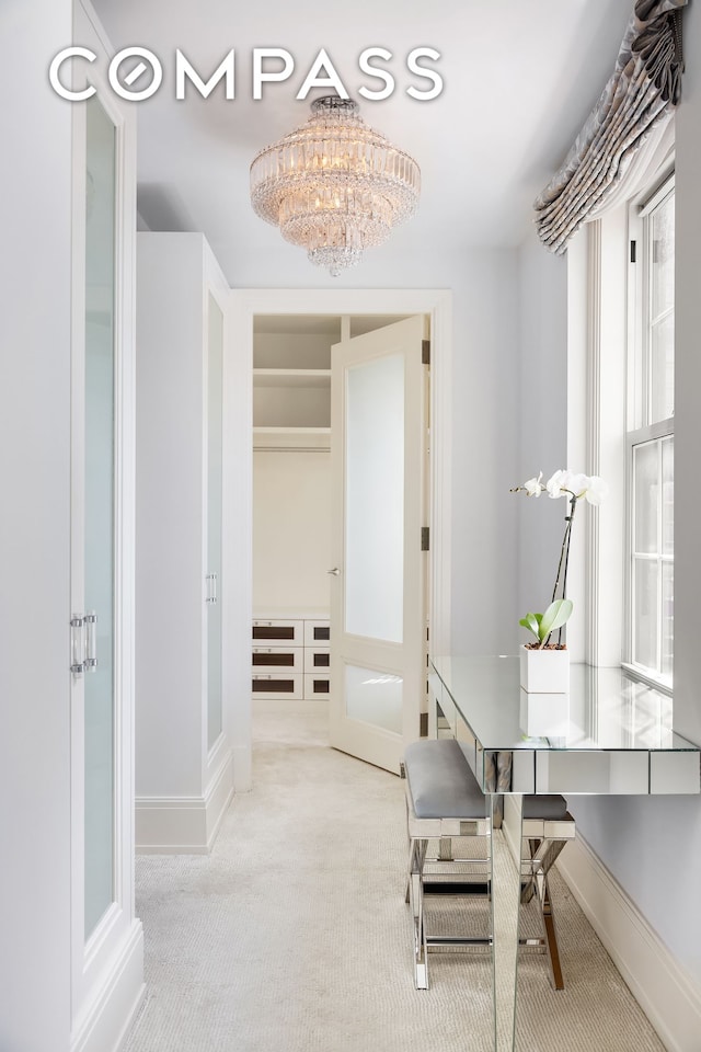 40 E 66th St Unit 12B, New York City, NY 10065 - carpeted home office featuring baseboards and a chandelier