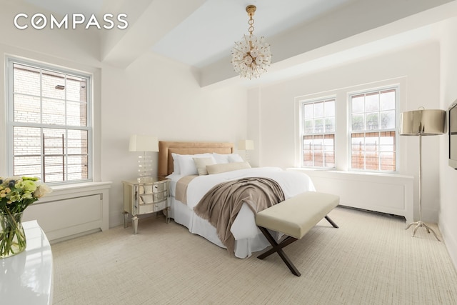 40 E 66th St Unit 12B, New York City, NY 10065 - bedroom with multiple windows, light colored carpet, and a chandelier