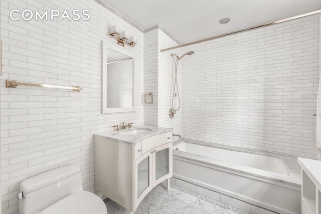 40 E 66th St Unit 12B, New York City, NY 10065 - full bathroom featuring vanity, tile walls, toilet, and shower / bath combination
