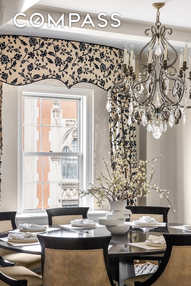 40 E 66th St Unit 12B, New York City, NY 10065 - dining area featuring a chandelier