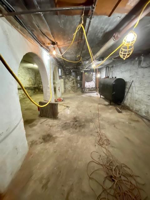 188 Mac Donough St, New York City, NY 11216 - unfinished basement featuring oil tank