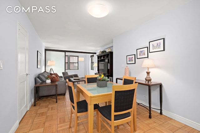 dining room with baseboards