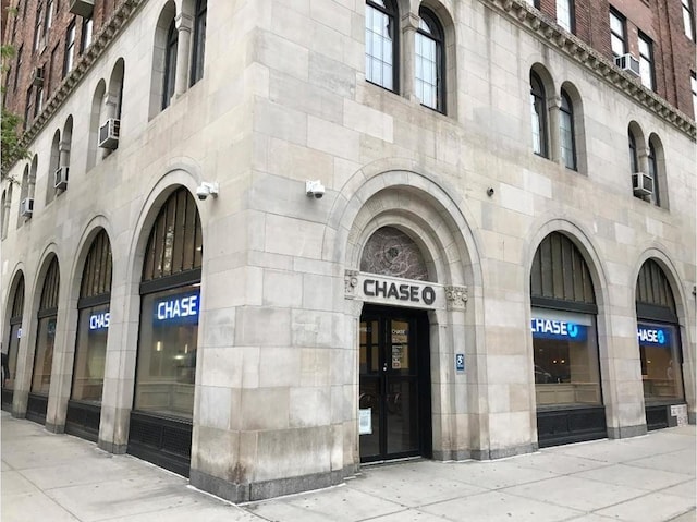 view of building exterior with cooling unit