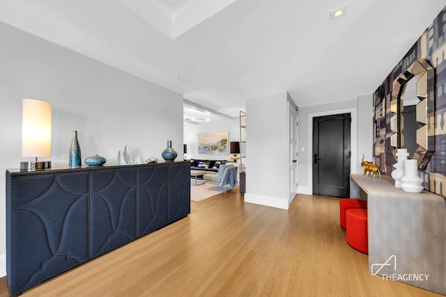 living area featuring wood finished floors and baseboards