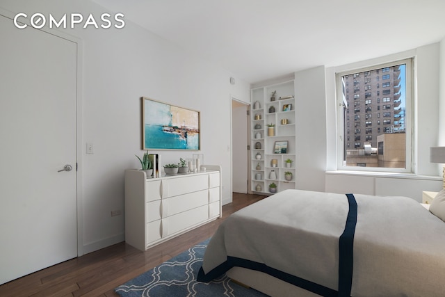 bedroom with wood finished floors