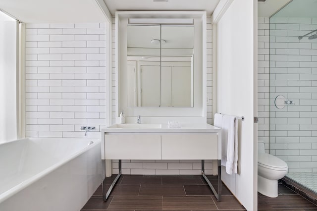15 William St Unit 42-A, New York City, NY 10005 - bathroom with toilet, vanity, and wood tiled floors