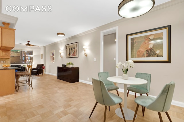 315 E 65th St Unit 1H, New York City, NY 10065 - dining space featuring crown molding, ceiling fan, and baseboards