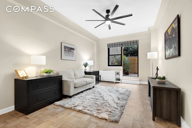 living area featuring crown molding, a ceiling fan, and baseboards