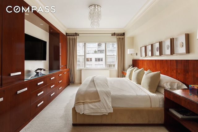bedroom featuring light carpet, ornamental molding, and a chandelier