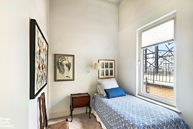 136 E 64th St Phc, Phc, New York City, NY 10065 - tiled bedroom with baseboards and access to outside