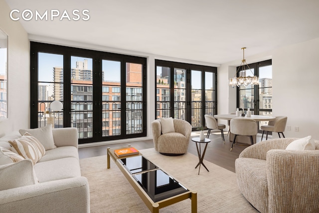 250 W 96th St Unit 11E, New York City, NY 10025 - living room featuring a chandelier and wood finished floors